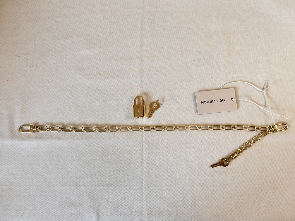 Taschenschmuck Gold