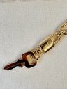 Taschenschmuck Gold