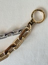 Taschenschmuck Edge gold silber