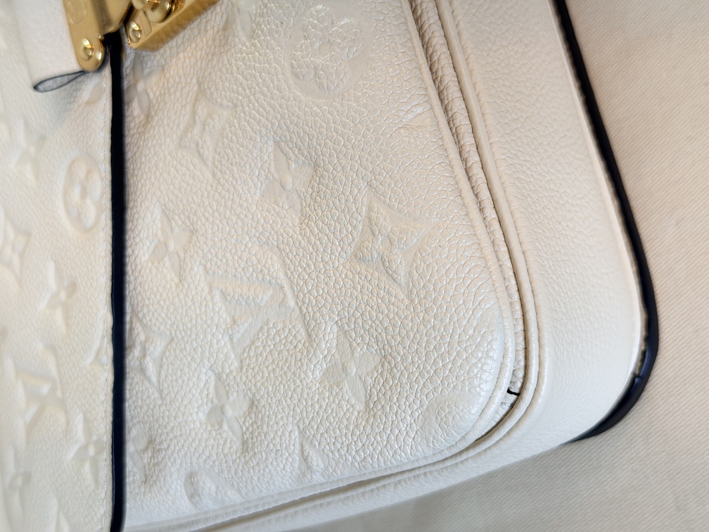 Pochette Metis Empreinte Creme / chocolate braided